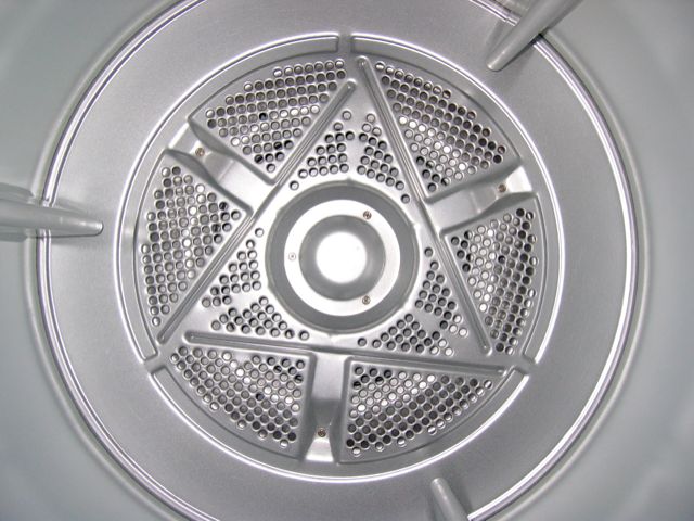 The inside of a clothes dryer. 