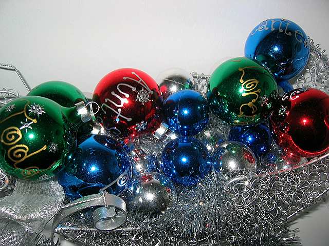 Colorful ornaments with family names painted on them make another striking holiday decoration.