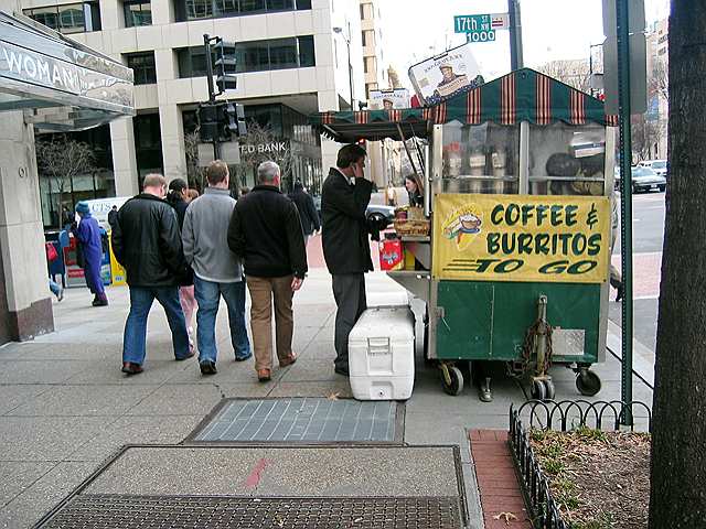 A vendor selling an unlikely combination of items near the corner of 17th and K Streets in downton D.C.