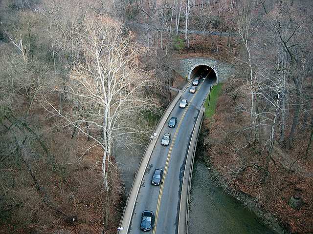 Traffic emerges from the tunnel on Rock Creek Parkway as seen from the Duke Ellington Bridge on Calvert Street above the park.