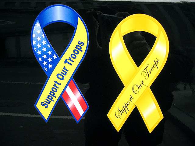 Two ribbons on the back of a full size pickup in downtown D.C.