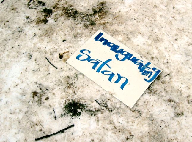 A discarded sign sits forlornly in the dirty snow of Malcolm X Park prior to the DC Anti-War march.