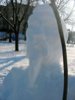 A poorly lit closeup of the snowman w/mustache.