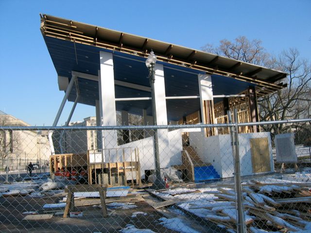 The VIP reviewing stand from last month's inauguration stands in a state of partial disassembly.