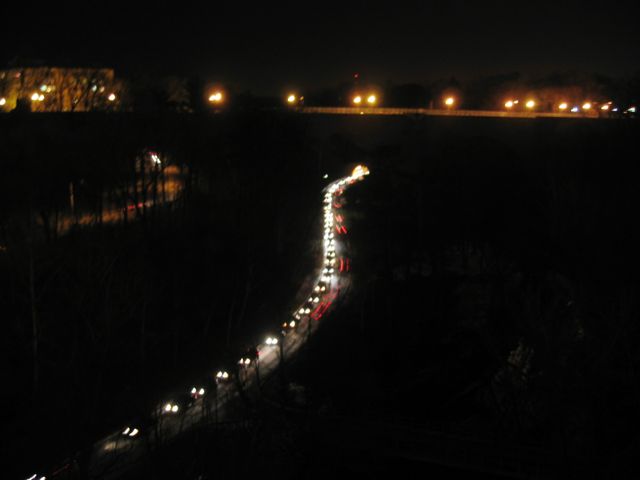 A line of cars snakes its way along Rock Creek Parkway at the latter end of a recent rush hour.