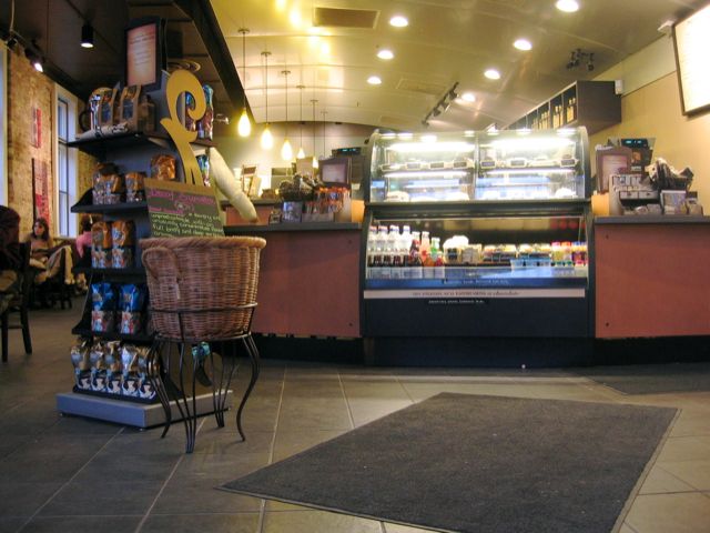 A big chain coffee counter waits for customers.