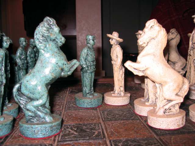 Chess pieces doing battle