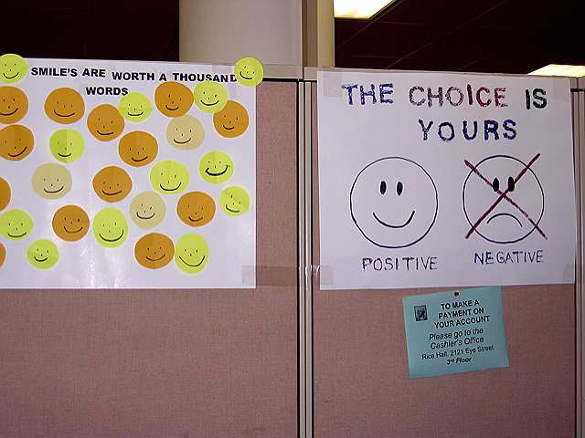 A sign in the cashier's office at GW suggests a smile will take you farther than a frown.