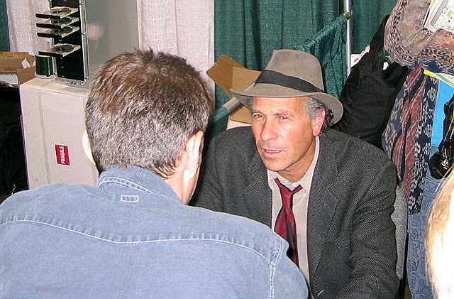 Greg Palast signs books at the Green Festival.