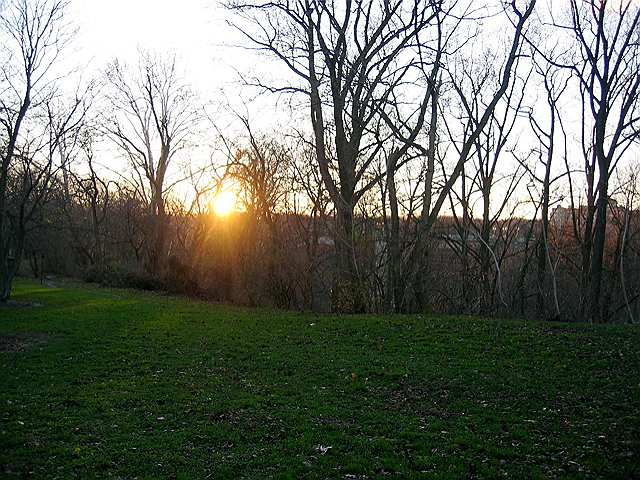 A late fall sun hovers on the horizon.