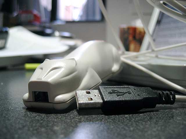 A CueCat USB barcode scanner.