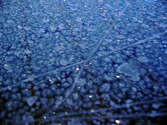 Frost crystals on a car window.