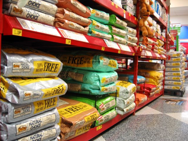 Bags of dog food sit on the shelves at our nearby large chain pet store.