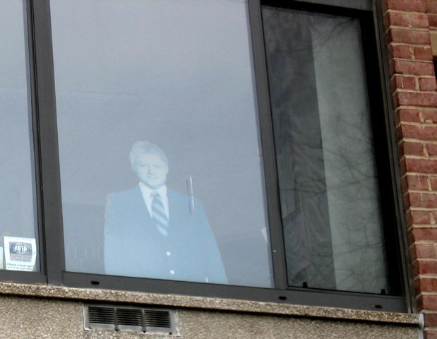 A cardboard Bill Clinton looks out over Calvert Street.