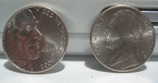 The new nickel faces down the old.