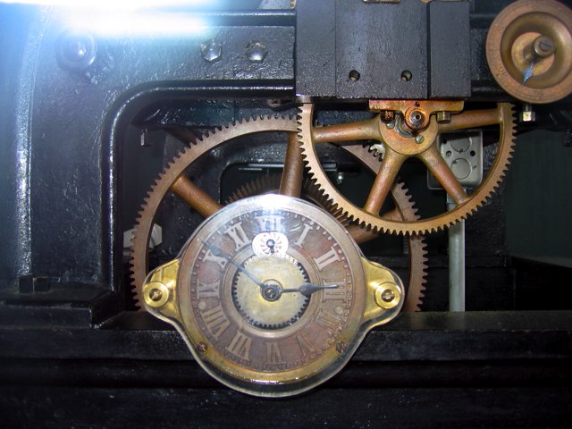 The clock works atop the Old Post Office Tower.