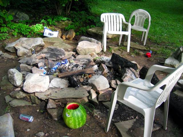 The scene around the campfire on the morning after the bonfire.