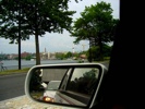 Georgetown across the Potomac with the Kennedy Center hanging over the road in the mirror.