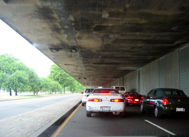 Traffic backs up on the Rock Creek Parkway underneath the overhang of the Kennedy Center.