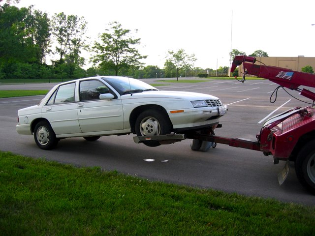 The old car getting hooked up for the long tow back to Michigan.