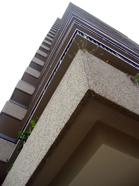 Looking up from the sidewalk at a high-rise building in Alexandria.