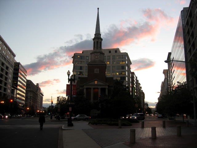 A bit of DC skyline in semi-silhouette looking down NY Ave. 