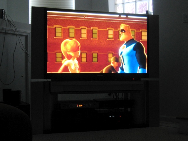 Mr. and Mrs. Incredible tease each other on M's humongo tv.