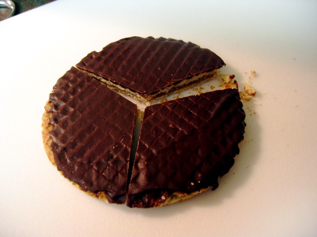 A chocolate-covered caramel waffle cookie