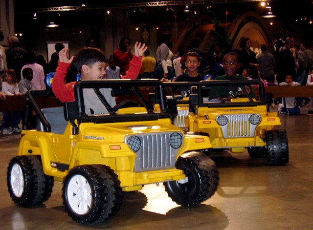 Kids drive mini Jeeps at the Washington Auto Show.