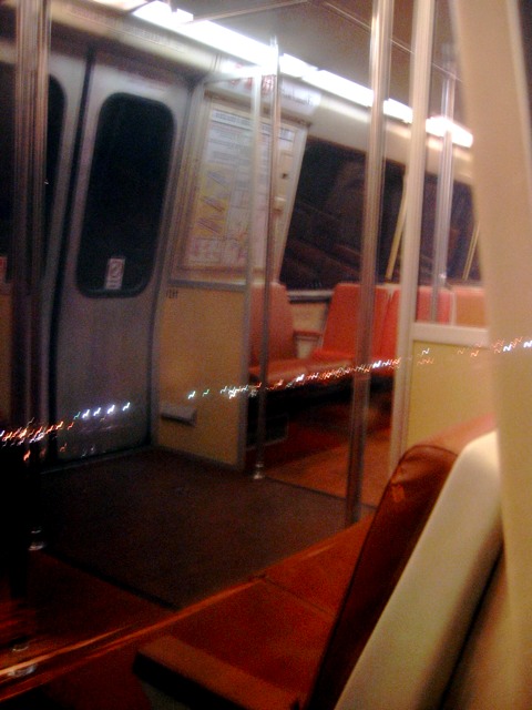 The view both inside and outside a metro car on the Blue Line headed downtown from Capital  Heights.