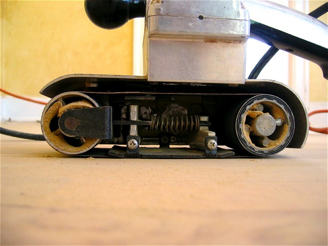 The floor's view of the belt sander we used to sand the edges and anywhere else we couldn't reach with the big drum sander.