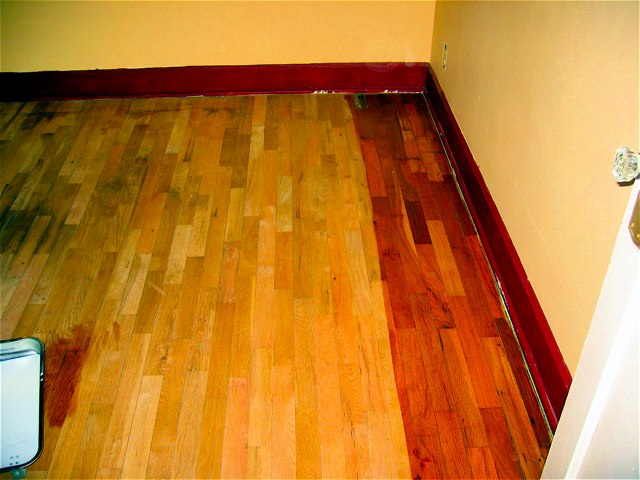 Our freshly-sanded floor getting its first coat of polyurethane finish.