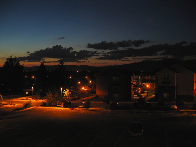 The remains of a sunset over the Lewis & Clark Apartments.