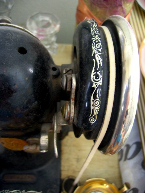 The handwheel on my sister's antique sewing machine.